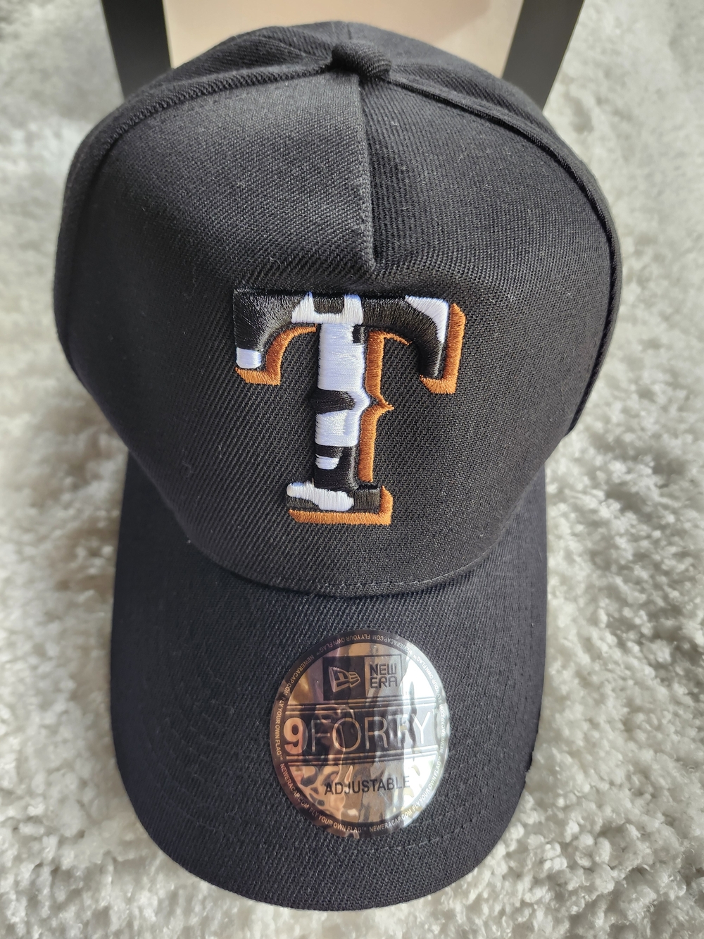 Black Baseball Cap with Orange and White 'T' Logo